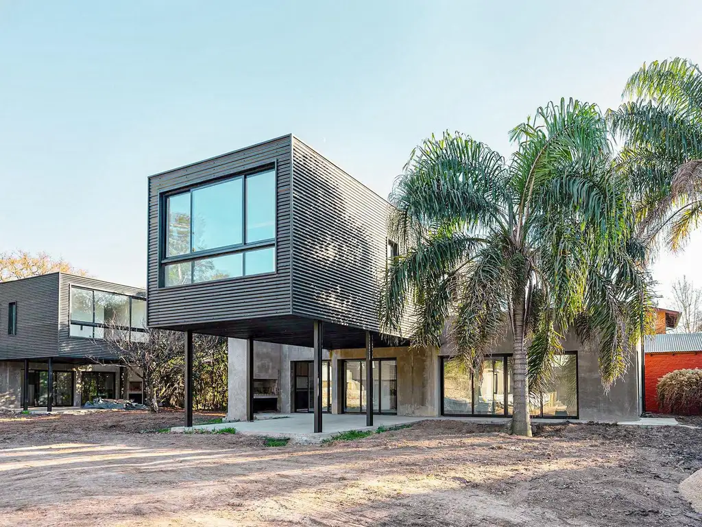 Casas de 2 dormitorios con jardín y pileta en complejo de Funes