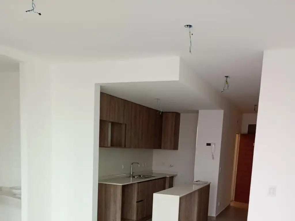 Departamento de tres ambientes a estrenar con cochera a la venta en Wilde Centro