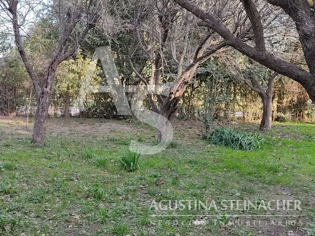 Terreno con casa en construcción